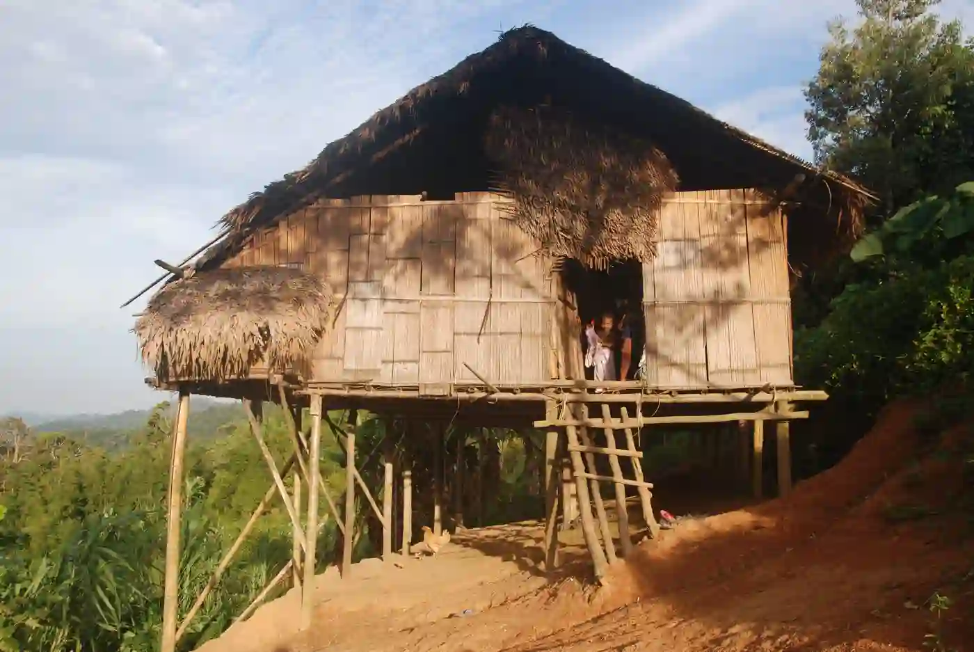 A Semai home built on piles on a hillside